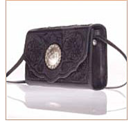 Custom made leather purse with flower carving, sterling silver concho and snap closure.